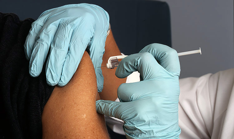 Nurse Administers a Vaccine. This image was released by the National Cancer Institute, an agency part of the National Institutes of Health. This work has been released into the public domain by its author, Rhoda Baer (Photographer). See: https://commons.wikimedia.org/wiki/File:Nurse_administers_a_vaccine.jpg