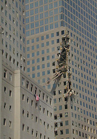 Beam from the World Trade Center lodged in a nearby building (photo by Michael Rieger, FEMA News. As works of the U.S. federal government, all FEMA images are in the public domain.