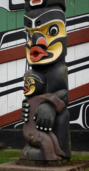 How did this traditional cannibal ogress come to be claimed by cryptozoology as a depiction of their "Bigfoot" cryptid? (Kwakwaka’wakw heraldic pole. Carved in 1953 by Mungo Martin, David Martin, and Mildred Hunt, it is in Thunderbird Park at the Royal British Columbia Museum, Victoria. Photograph by Daniel Loxton)