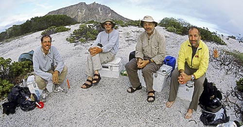 The expedition to retrace Darwin’s footsteps in the Galápagos camps
on the same beach where Darwin camped in September of 1835. Left-right: Frank
Sulloway, Chuck Lemme, Phil Pack, and Michael Shermer. The volcanic peak in the
background is Cerro Brujo.