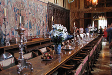 The Hearst Castle dining room, filled floor-to-ceiling with rare museum-quality furnishings, (and used as a model for the dinning hall in the Harry Potter films), also featuring humble ketchup and mustard bottles on the table among the sumptuous settings. 