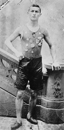 Not yet Houdini, Ehrich Weiss poses wearing medals he won as a member of the Pastime Athletic Club track team in New York (c. 1890). McManus-Young Collection (Library of Congress)