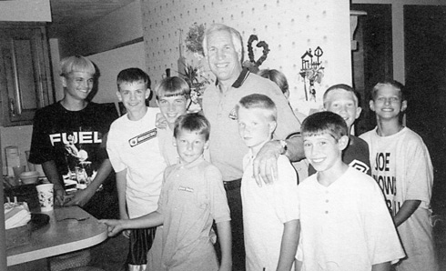 Jerry Sandusky around 1999 with Second Mile kids, most of whom later claimed that he abused them and received millions of dollars in settlements.