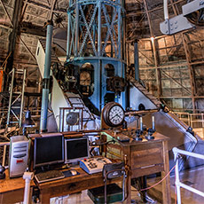 Original controls to move the telescope dome sit to the right of the modern computer. (Photo credit: Ron Constable)