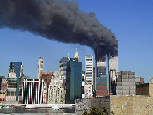 Plumes of smoke billow from the World Trade Center towers, September 11 (photo by Flickr user Michael Foran at http://www.flickr.com/photos/pixorama/ used under Creative Commons license Attribution 2.0 Generic