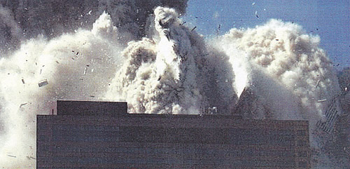 WTC7 engulfed in debris (photo from NIST Report Executive Summary 2008)