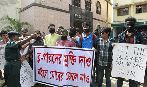 The teachers and students and online activists gathered in front of Dhaka Central Jail holding placards: 'Either release the arrested bloggers from jail or put us into it.'