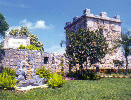 A view of the present front entrance to the Coral Castle showing sections of the curtain wall and the turret that is composed of two rooms, a lower one for tools and storage and an upper, living room for Ed Leedskalnin.