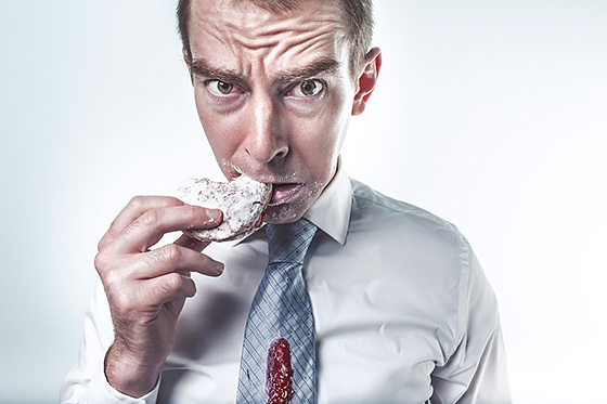 Man eating donut (https://www.pexels.com/photo/food-man-person-eating-2261/). Images used under Creative Commons Zero license. (https://creativecommons.org/choose/zero/)