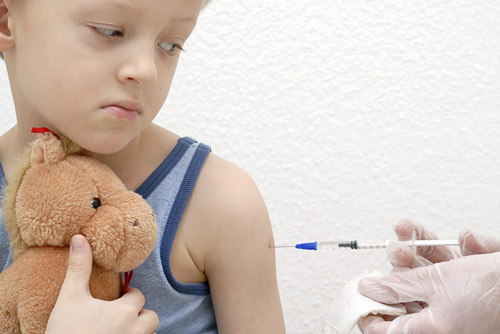 photo of boy receiving injection